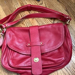 Barney’s red leather handbag